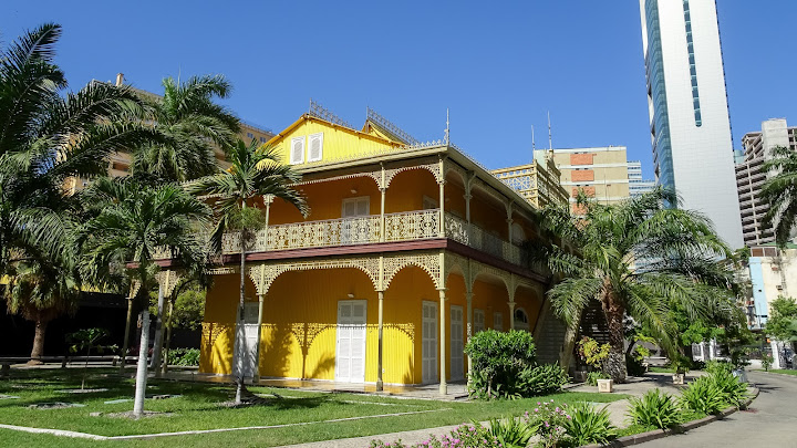 Yellow building in colonial style is used for a lot of music