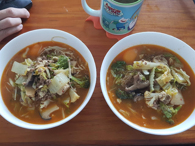 Two bowls of kimchi soup
