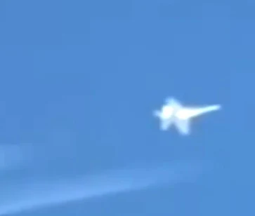 Close up image of the jet following the unknown Alien craft.