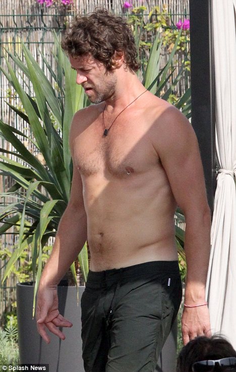 Howard Take That Howard Donald's nipple piercing is back for good on Ibiza