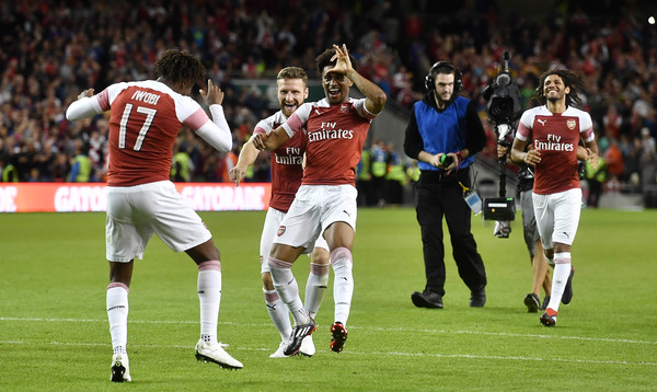 Arsenal players celebrate after Alex Iwobi's winning penalty after a penalty shoot out during the Pre-season friendly International Champions Cup game between Arsenal and Chelsea at Aviva stadium on August 1, 2018 in Dublin, Ireland.