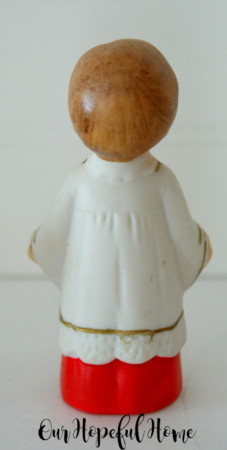 Vintage porcelain choir boy in robe with candles made in Japan.