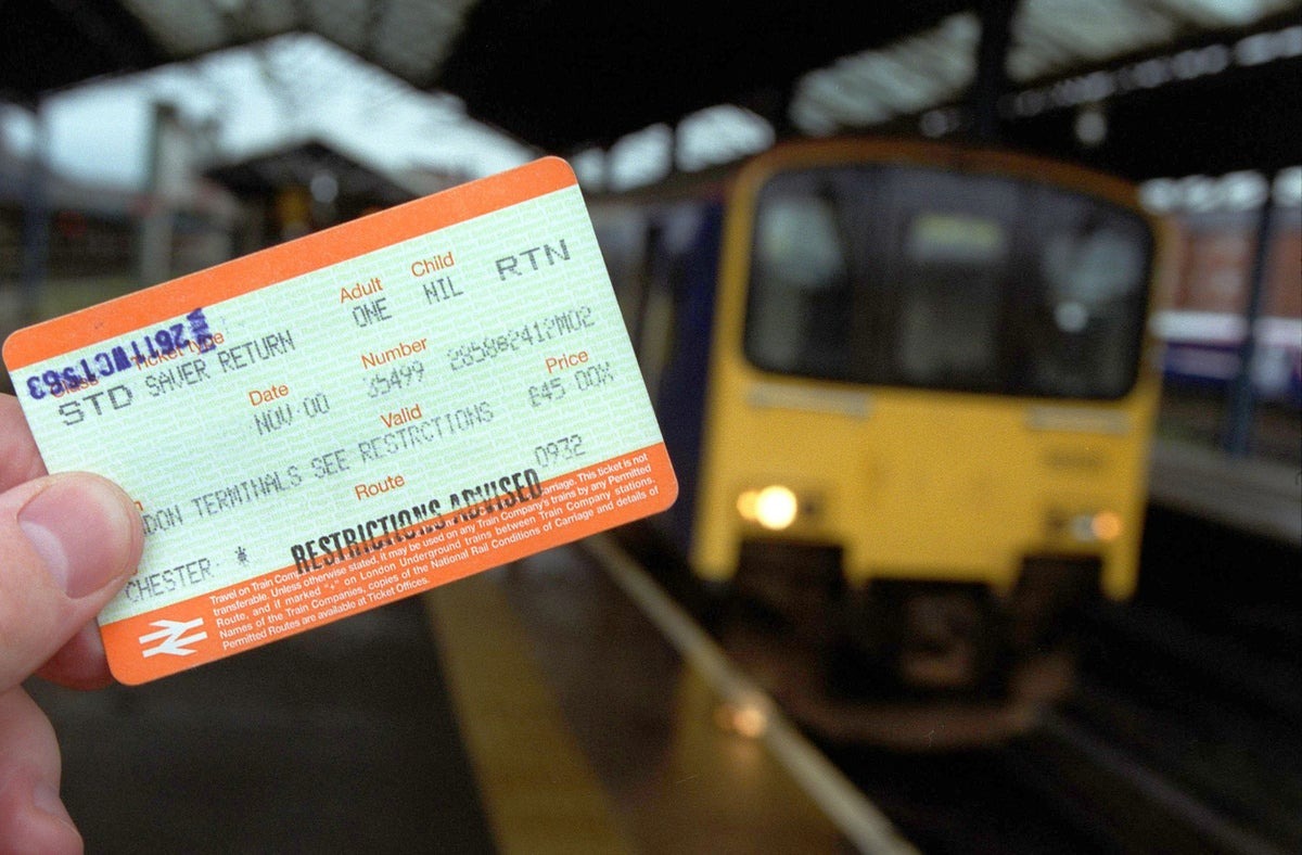 Train ticket shown against a backdrop of a train.