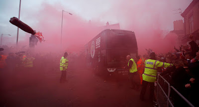 TUESDAY Liverpool fans had gathered around the Arkles pub on Anfield Road to greet their own team bus prior to kick-off. It turned hostile for the Citizens whose team bus was pelleted with eggs, flares, cans and glass bottles by Liverpool fans. It had its windows smashed - another bus had to be arranged to take players and staff back to Manchester.    UEFA  is now investigating the incidence and charges will be brought against anybody found guilty of the disturbing occurrence.