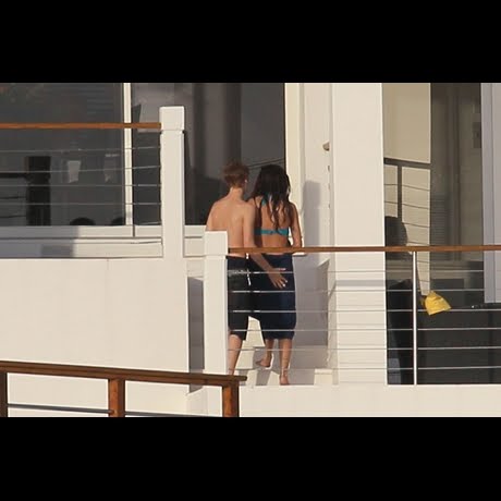 Justin Bieber and Selena Gomez canoodling on a yacht in St. Lucia.