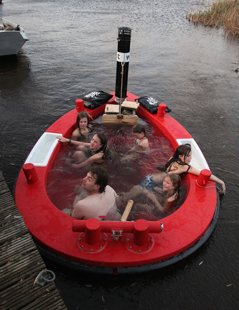 http://www.ifitshipitshere.com/the-hottug-a-motorized-floating-wood-fired-hot-tub/