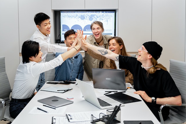 Coworkers encouraging each other