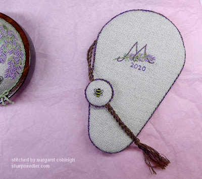 Embroidered initial and date on back of scissors keeper along with other side of fob with embroidered bee