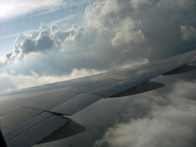 plane wing going through clouds