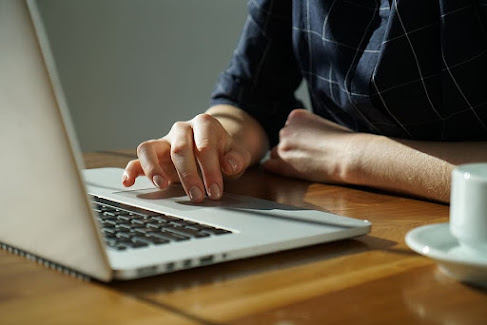 Business owner at work on a computer.