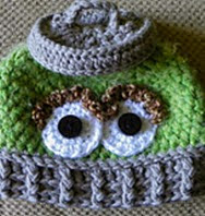 http://www.ravelry.com/patterns/library/grouch-in-a-can-hat--oscar-the-grouch-inspired