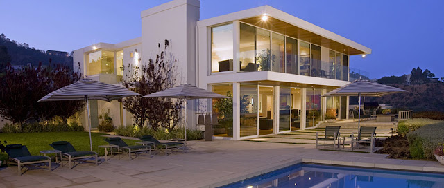 Picture of modern mansion as seen from the pool area