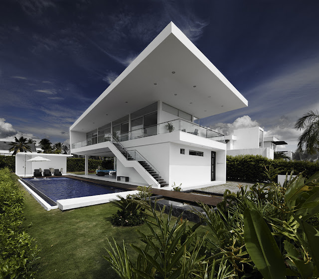 Modern home with swimming pool as seen from the backyard 