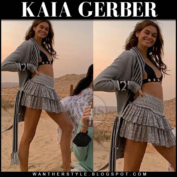 Kaia Gerber in grey cardigan, black bikini and grey mini skirt