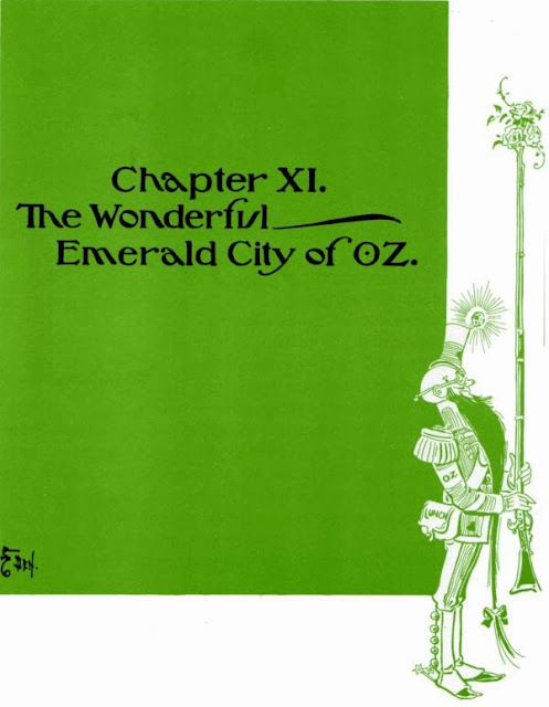 The soldier with the green whiskers stands proudly with his musket (filled with flowers) on the title page for "Chapter XI. The Wonderful Emerald City of OZ."