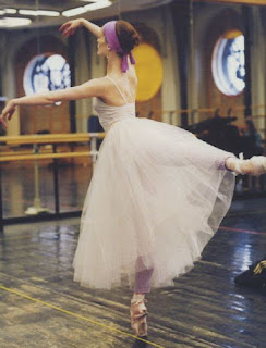 ballerina in her tutu and leg warmers