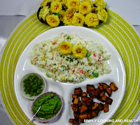 Mixed vegetable rice with yogurt served with green chili, cilantro sauce and deep fried plantain pieces
