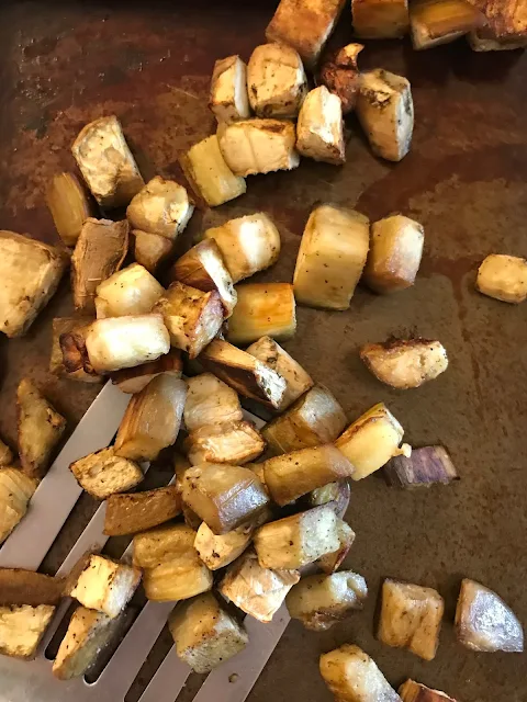 Cooking eggplant on a baking sheet.