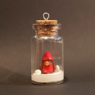 Robin in a jar by welaughindoors