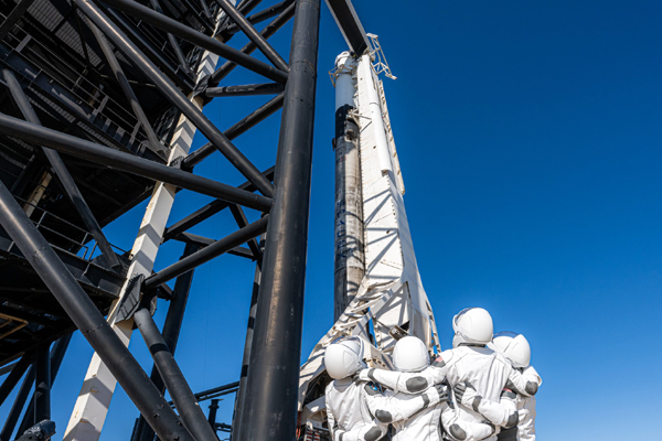 The Inspiration4 crew gazes up at the Falcon 9 rocket and the Crew Dragon Resilience vehicle that will be the astronauts' orbital home for the next three days...on September 15, 2021.