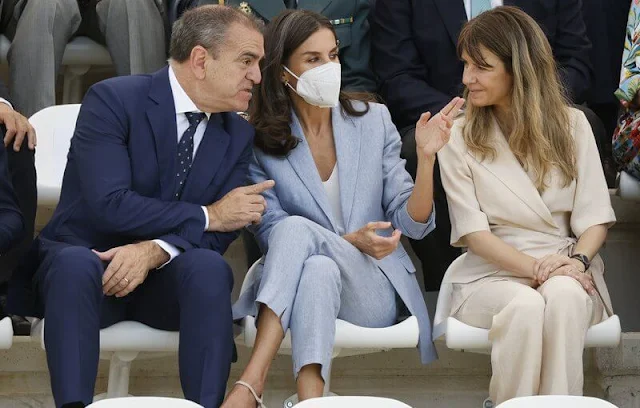 Queen Letizia wore a sky blue suit, blazer and pants, by Adolfo Dominguez, and global leather buckle wedge espadrille by Gaimo