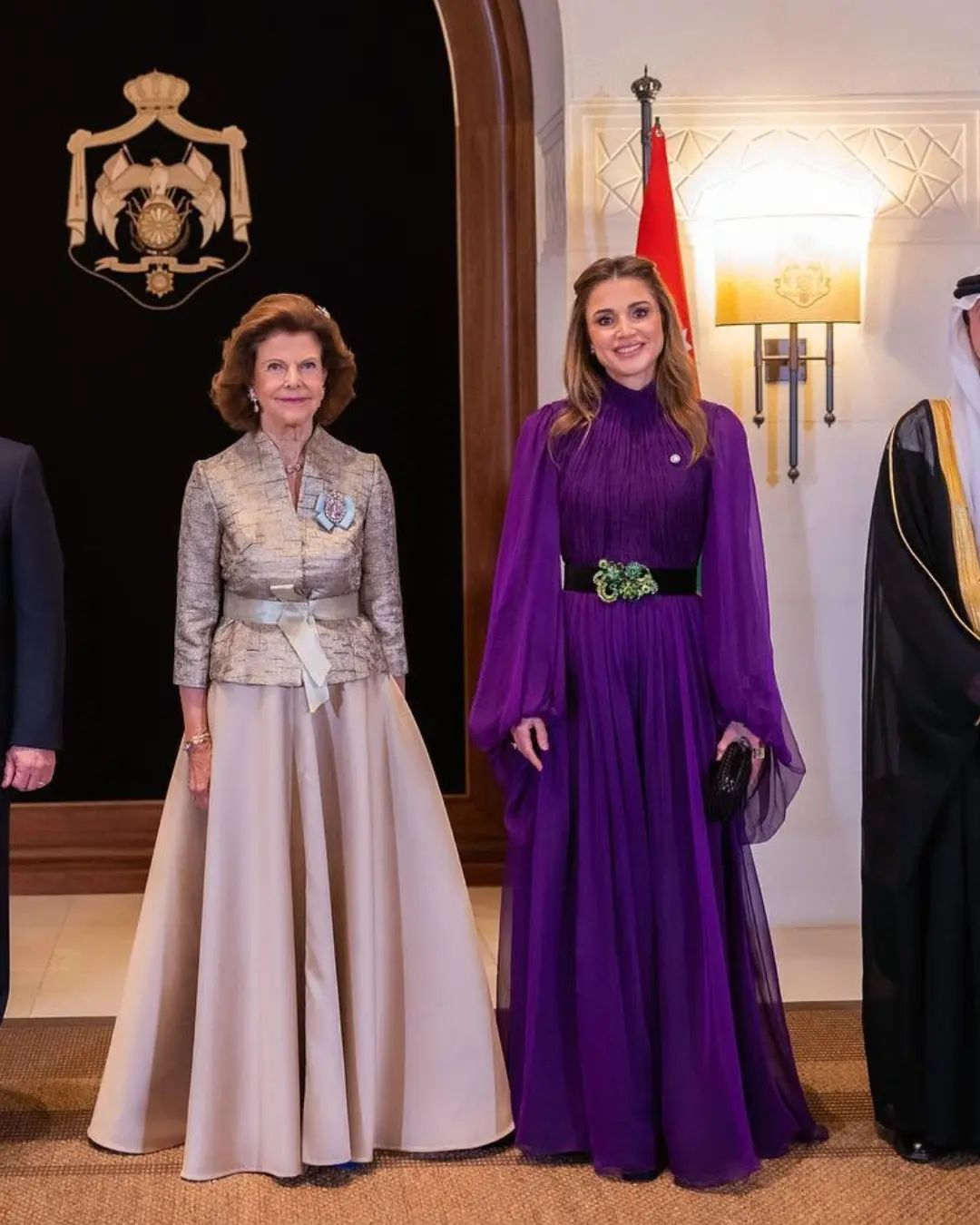 Queen Rania was wearing a purple Andrew GN Balloon-Sleeve Belted Crinkle Chiffon Gown at the Sweden State visit