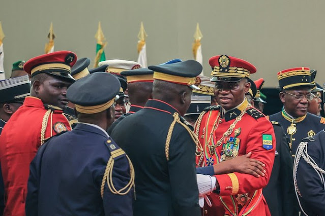 Gabon coup leader sworn in as interim president in scene of jubilation