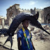 fisherman carries a swordfish in somali