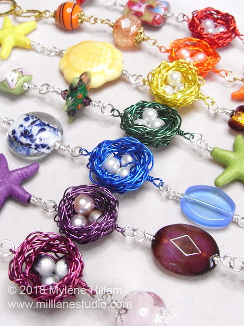 A rainbow of wire bird's nests bracelets with secure wire wrapped loops.