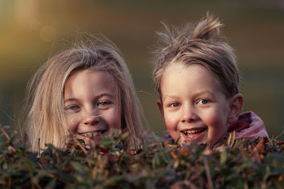 two young girls laughing