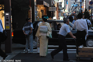 A lady wearing Kimono on the street