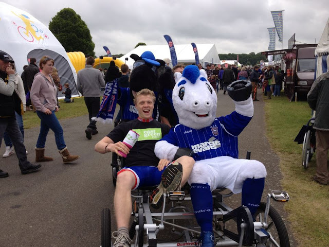 Ipswich town football mascots having a go on the bike