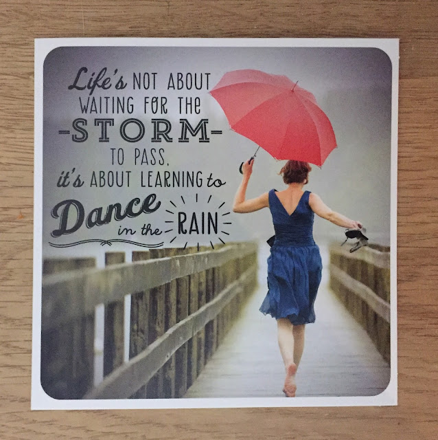 Photo of girl with umbrella in rain