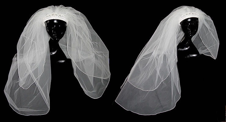 This lovely white vintage veil has a crown style headpiece