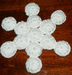 http://translate.googleusercontent.com/translate_c?depth=1&hl=es&rurl=translate.google.es&sl=en&tl=es&u=http://crochet.about.com/od/snowflakes/ss/snowflake-bottle-cap-trivet.htm&usg=ALkJrhjVy-SGwMZ0uYm9bxx3HQK6yZMurA#step-heading