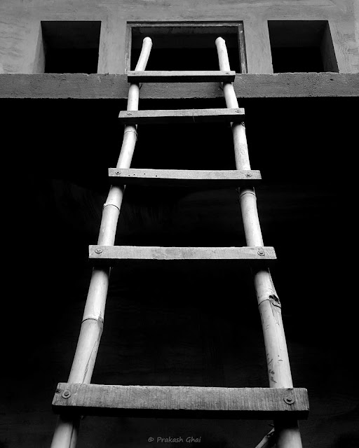 A Black and White Minimalist Photograph of a Wooden Ladder shot via Samsung S6 Smartphone Camera