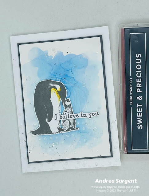 A watercoloured background with Basic Gray Sweet & Precious penguins creates a gorgeous scenic card and add some embossing paste for a little extra flourish.