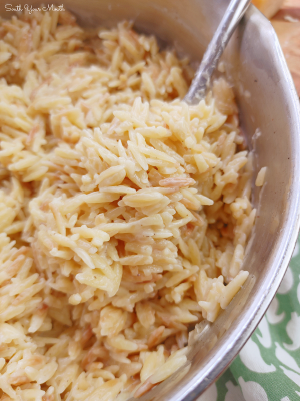 Easy Cheesy Parmesan Orzo! A simple no-fail side dish recipe with orzo pasta cooked in a parmesan cream sauce that comes together in minutes and cooks perfectly every time.