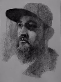 07-In-between-laughs-Charcoal-Portraits-Mehmod93-www-designstack-co