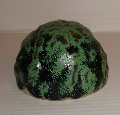 pinched-paperweight-with-green-to-black-satin-matt-glaze