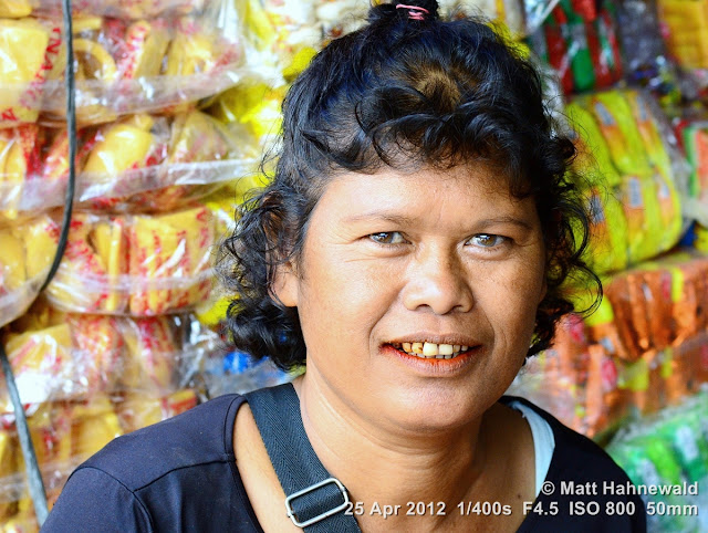 people, Batak woman, street portrait, Indonesia, Sumatra, Lake Toba, betel nut, betel quid, areca nut, sirih, paan, chewing tobacco, red coloured salivation, red stained teeth