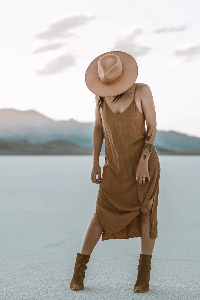 stylish woman wearing brown summer dress and boots