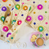 picture of a crochet blanket being made and cup of tea