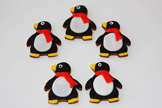 5 penguin biscuits with red scarves