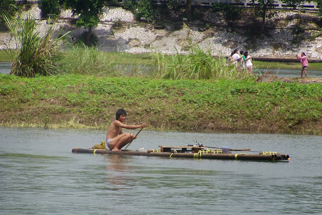 Guilin fisher man on raft