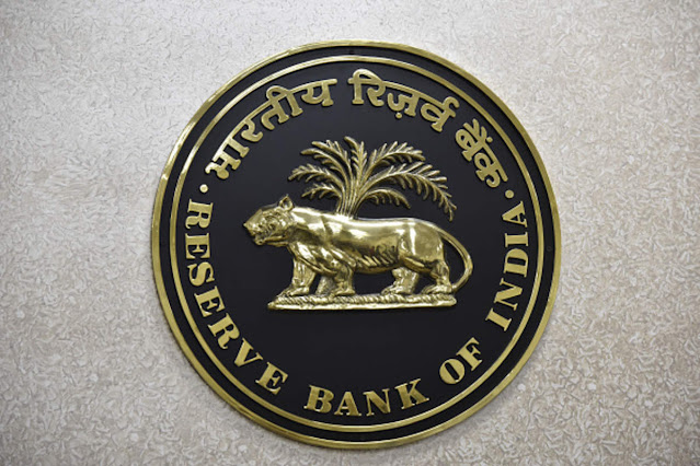 The Reserve Bank of India (RBI) logo is displayed on a wall inside the Reserve Bank of India in New Delhi