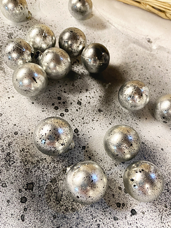 silver balls with black mist