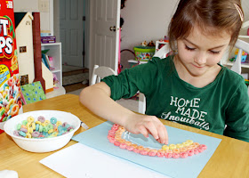 After watching the "Roy G. Biv" video by They Might Be Giants, Tessa used Froot Loops to create a rainbow. She was careful to put the colors in the correct order.