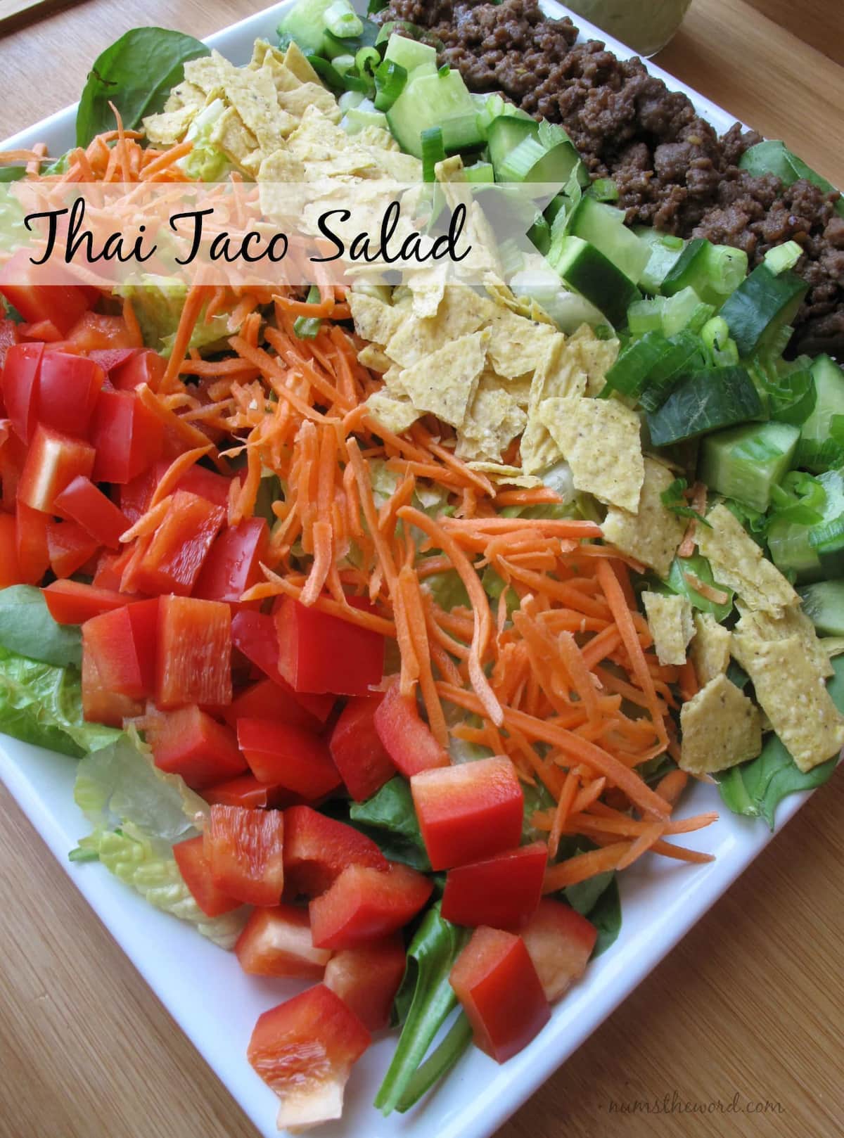 A down shot of Thai Taco Salad on a white plate.
