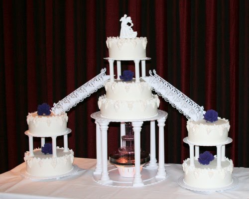 Seven tiers of Wedding Cake richly embellished with sugarcraft grapes and 